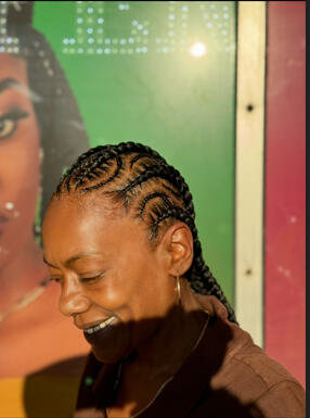 smiling profile outside braids