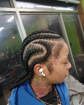 Braided hair outside earbud